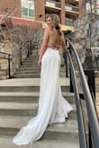 I purchased this dress last minute for my wedding and I am SO glad I did. I ordered a 6 (my usual size) and a size 8 just in case. I ended up wearing and keeping the size 8 and will send back the size 6. My hips are 39" and while I could "fit" in the size 6, I could barely walk because of the mermaid style. This dress is truly a beautiful gown and has such beautiful details and lace on the outer layers. The bust would fit many sizes. One suggestion is don't tie the strings too tight across your back because they will dig into your skin in pictures and not be too flattering. Lol, but I am in love with this dress and the train is beautiful. It is very long, but I wore 4.5" heels and it worked well for me. I picked up the bottom while I walked around and it was perfect. - Lisa F.