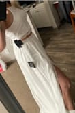 This two piece dress is very cute, but I decided it wasn't for me and went with another more elaborate Lulus wedding dress. The bottom has many layers and is made very nice. I ordered a small first and it was a bit too snug on my 28" waist, the top would have been perfect, though. I exchanged for a Medium and while it fit great, I just wasn't in love with it for my wedding. - Lisa F.
