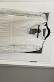 The dress came beautifully packaged. It was also quite fast shipping (less then 2 weeks- international) I was also quite pleased with the quality. It's beautiful on and will only need a few alterations in length. I ordered a small. - Jocelynn N.