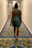 This dress is amazing and the light truly makes it shimmer and glisten. The top definitely will need some tape bc it is not fitted, which is why I rated it runs large. However, I am glad I got my size which is small bc the zipper area in the waist is fitted. - Makeda W.