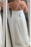 The dress fits great! A little long for me where i need to get it to a seamstress to make it shorter. I was surprised by the dress having 3 layers but it is very light weight to move in. Though I was very happy to see that you couldn't see the color of my underwear since i'm using this dress as my small reception dress. - Kathy G.