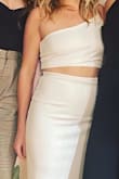 I've never written a review before and that's how much I loved this dress! I've always been self conscious of my stomach but felt the skirt went high enough up to cover most of my problem areas. I ordered the small, which fit, but stayed with the medium. - Meg