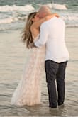 I wore this dress for our beach engagement photo shoot session. The lace detailing is beautiful and the quality is great! - Dana A.