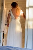 This is my wedding dress that i bought on a whim hoping to be able to dazzle it up! I never expected it to be so perfect though. I ordered an XS because it was the last one in stock and i needed it. I am normally a medium, so this was a crazy stretch that worked out! Don't get me wrong it is tough to zip, but you're definitely  still safe to size down! Added lace under the outer skirt layer and cut the back into a v, so there is a lot you can do with this dress because the price is definitely right! - Taylor M.