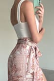 This bodysuit is a perfect simple top that pairs well with pretty much anything. Jeans, shorts, skirts, etc. Love that I can wear it without a bra and it isn't see-through. I am planning on ordering it in black as well! I wore it here with another Lulus item, the Take A Walk With Me Ivory Paisley Print Satin Wrap Midi Skirt and got tons of compliments! I also wore it two days later with jeans for a date night out. :) Definitely a closet staple! - Kellyn S.