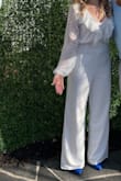 I absolutely loved this jumpsuit and it fit me perfectly! I'm about 5'3"-5'4" with hourglass figure and wore this with heels 3.75" heels and it worked! It's not see-through at all and I wore it with a sticky bra and you couldn't see it at all. Its very wrinkly when you first take it out of the package but steams out super easily! I wore this for my bridal shower and got tons of compliments! I definitely recommend! - Nichole B.