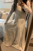 I can't say enough good things about this gorgeous dress. The material feels so high quality, and the weight of the dress and train feels like it should cost way more! The nude color underneath goes well with my medium skintone, and the lace details get prettier every time I look at it more. It's a very long dress! I'm short, so I'm getting it hemmed and adding 3 bustles. The neckline is so elegant, and perfect if you have a smaller bust like me. The sleeves are too long and the back is subtle enough when showing skin. The train is not too much, but still gives some drama! It's my dream dress at an affordable cost. I've seen nude boho lace dresses from 1k-3k! If you have a vintage boho wedding, this is the dress! Can't wait to wear it for our micro wedding. Photos are true to color! - Nicole E.