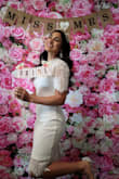 This dress was a huge hit! It fit me like a glove and was very comfortable to wear. The material is soft and the perfect white. Very classy and flattering for my body type. It was perfect for my bridal shower! - Anie J.