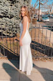 This dress was an absolute dream! I was looking for something simple, elegant, but also with a little bit of glamour. I think this dress did that wonderfully. I did add a little sparkle myself to it but the dress was beautiful even without it. This dress is stretchy, comfortable, and gorgeous. It fits like a glove, highlights all the right curves, and it's very comfy. I wore it all day and I still didn't want to take it off! I feel like I could run and jump around with this dress all day long! Both a Medium and a Small would've worked for me but I decided to go with a Small because of my chest. The dress is stretchy and hugs your body so both sizes felt very freeing for me. Your size just depends on your body type but I would say this dress is true to size. I could not recommend this dress enough especially at its price point! So happy with it! - Natacha L.