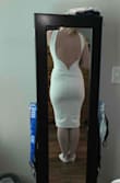 I ordered this in hopes of wearing it as a rehearsal dinner dress. The back v actually has wiring in it to keep the shape. I can go either way with small or medium with Lulus (in fact, I'm sending back a small in a different dress that was too big), but I barely got this on. I mean I almost gave up hope of ever seeing it on because I thought it would rip. I was nervous about the straps accentuating my broad back (they do), but they're also too big, so I'm not sure who they're supposed to fit. From the front they look like they're falling off. With this material you would probably always need shapewear, but with where it lays I worry you'd be able to see it. All in all a good idea but the fit is weird. - Samantha O.