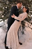 I loved this beautiful lace wedding dress. The lace looked beautiful with out pictures in the snow. I was in between needing a small and medium, I ended up going with the medium, I added a hook and eye on the back for the small gap in the waist and it worked beautifully. Highly recommend this beautiful and affordable wedding dress! - Emily E.
