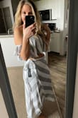 This skirt is absolutely gorgeous in person! I like that you can buy the skirt and the top separately for this two piece. I got the skirt in a Medium and the top in a Small. I love it and can't wait to wear it out downtown with my husband as the weather gets warmer. You won't be sorry you ordered this! I plan on wearing a small heel sandal with it, but even flat footed it wasn't extremely long like the maxi skirts tend to be. - Lisa F.