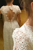 I ordered this dress for my mini-wedding. It had to be shipped to Europe, so returning is not really an option. Normally I wear size M, and sometimes around the waist I need L. So I thought, if it runs a little big, I'll be fine. I can always take it in. But no....The dress is two sizes up in the waist and also way to big around the chest. I'm really disappointed, because taking it in is not an option with this much a size difference. Little note with the picture: The back is not placed as it is supposed to be, because it is too big I crossed over two pieces of lace to make it fit.
Other than that: Beautiful lace, really pretty dress!!! - Gerlant D.