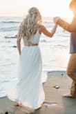 This two piece set worked so well for our engagement photos! The waist was a perfect fit and the skirt material had good weight to it and felt like good quality. I had to take in the top on the sides myself to give it enough support to wear braless and have the back not too cinched up. Overall, I would buy it again! - Elena W.