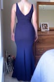 Material is thicker and heavier than I was expecting but feels high quality. I chose a size XS based on reviews but S would have been better. It is very form fitting and elegant. - Michelle M.