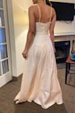 The dress looks okay, not what I expected completely though, but my family loved it. I think this is just a me thing rather than the dress. The inner lining is too short for me, which is odd. Have a look at my pictures and judge for yourself. The length is perfect, doesn't need hemming for me. - Alma R.