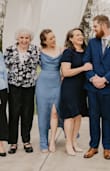 I was a little nervous about purchasing this dress because very few reviews had been written about it yet, but I absolutely LOVED it! I wore it to my brother's wedding and it fit PERFECTLY! I regularly wear a small, but I am not a teeny-tiny, nor a perfectly proportioned person. This dress did a wonderful job of accenting my figure without overemphasizing my belly region, which I was afraid this dress might do! The slit in the dress is sexy and classy without showing too much and the fabric is classic. My only warning is that the top portion of the dress easily falls open due to its design so the wearer must be conscientious and ensure they do not EVER bend over without holding the top of the dress closed, including leaning slightly forward in chairs! Oh, and the dress is quite long! It brushed the floor even with the tall heels I wore and I would imagine any wearer shorter than 5' 4" will definitely want to hem it. - Cayla B.