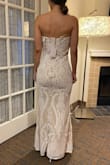The dress is very nice, not exactly what I am looking for, but still cant deny how well made and fitting this dress is, just find it a bit casual for what I have in mind for my wedding, but I can see how this is beautiful for those looking for a nice budget dress that still fits nice. - Alma R.