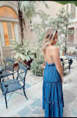 I love this dress! I am taller and have a hard time with maxi dresses being too short. This one has a full skirt to it and hits ankle length so it doesn't drag the ground. I traveled with it and got so many compliments! I love the open back and the front covers as much as you want it to. - Tamryn O.