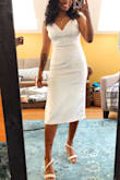 The dress fits true to size and it looked amazing! It's also super comfy and the material has a little stretch to it as well. - Jessica L.
