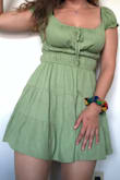 I added this to my cart last minute and I love it the most! This dress is so fun. You can adjust the tie and chest area to change the look. It can also be worn off the shoulder! I purchased the green and it is a bright, vibrant color. The shape is very feminine but modest. It looks great with sneakers and heels. Most jackets pair nicely, too! One of my new favorites :) - Taylor B.