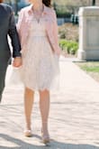 I'm in love with this dress! I wore it for my partner and I's spring elopement. I'm between an XS and S and the S fit perfectly. The bottom has tulle underneath which adds volume, but not too much. It was cold out so I wore it with a denim jacket. - Kristy S.