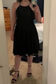 This dress is so cute! It has adjustable straps which is great. It's a little bit of a heavier fabric making the skirt feel full. It's super comfy to wear, and a very versatile little black dress. Your favorite strapless bra can be worn with it. It makes you feel pretty! I highly recommend it! - Maronda C.