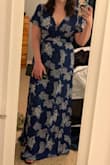 I love this dress! The cut it perfect! However, I did order the same size in black and the cut was different. I didn't like how it fit so I returned it. So be aware that if you order 2 of the same dress they may be cut differently. But this blue dress fits perfectly! It shows just the right amount of cleavage to feel sexy  but not too much. It's so fun to wear. The length is a little long for shorter people, but I tried it with 2" heels and it worked out fine. The material is light but not thin, so hopefully it'll work perfectly for a Hawaii wedding. You can also wear a regular bra with this dress. - Maronda C.