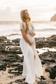 I absolutely loved this dress for my maternity photoshoot, but it did run small on my chest for my maternity measurements (I was 23 weeks at the time of the photoshoot). Since I'd rather have this dress fit post-pregnancy I made it work. You could also buy a slip or lacy bralette to solve that problem if pregnancy made you extra busty. - Jennifer M.