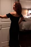 Dress is little hard to put on as you have to put it on over your head and it's a snug dress. But as it fits snug, once you pull it down and on, it's stretchy enough to cling and not too stretchy that it moves around. Well made. I got many compliments! - Michele A.