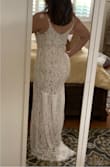 This dress is really pretty. The way the back of the dress drapes into a train, the lace pattern, and the simple v neck tank. The body-hugging fit really showed off my curves. I have ordered four different dresses On Lulus for my beach wedding and this placed third.  Beautiful dress but I chose to go with another. - Angela R.
