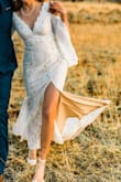 I wish I had more reasons to wear this dress because I loved it so much! You can't beat the price, and I was more than impressed with the quality! I felt beautiful on our elopement day, and the sleeves are so fun.
It hardly needed any alterations, I just added a bustle and some fitting around the bust area. The only (very) minor personal complaint is how the nude lining is detached from the lace part, so it kind of shifted around a little too much for my liking. So I had the seamstress sew it together (2nd picture), and all my alterations were under $80!
If you're hesitant on ordering a wedding dress online (like me), you won't regret this one. Even if you turn out not to love it, Lulus seems to have a pretty painless return policy. photog: mareemiragliaphotography - Emily D.