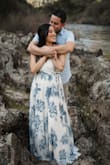 I wore this for my engagement photos and it looked stunning! A bit long for me but it was easy enough to pick up and maneuver. My bust would occasionally pop the front button open when I bent over so if you're larger be aware of that. - Noelle R.