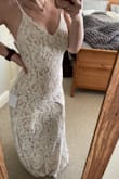This dress is STUNNING and everything I ever wanted in a dress for 98USD!? WHAT??? When I got it I was a little disappointed. It fits perfectly, a little long however. But The front has that sort of ruffle and it looks like it doesn't belong. It makes two triangles in the front and is very odd, no one I show understands why. I'm going to get it altered completely off to see if I like it better. Other than that its a gorgeous dress. Perfect for a 2nd dress for reception. - Rachel J.