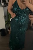 I do not shop online at all and I took my chance on this dress. It fits so perfectly I had space to breathe and it was not snugged. I don't have cleavage and it gave me a boost. It was beautiful I had so many compliments. I didn't take pictures but I did record a video when I first tried it on. The pictures Are not that great because it was a video and I had to screenshot it. I normally don't write reviews but I do read them so I thought it was important to post one because I absolutely love the dress and the way it fit I am a big girl - Christina G.