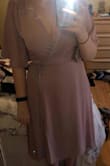 I bought this to wear to a wedding and decided not to wear it. The color was darker than I expected. The front cut runs VERY low. I am 5'7 and felt the dress is a little long to be considered midi. The chest area was very loose IMO and would have required some serious fabric tape and pinning. Felt like the string made the dress feel less "elegant". Fabric quality is great though. The dress hugs the lower half of my body nicely. Overall the dress is alright, but I did not love it. - Jennifer C.