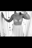 I had my eye on the True Love dress for a few years, before we were even engaged! I'm a size 6-8 in dresses normally. I ordered size 6 based on other reviews and it fits very well. It is snug around my rib cage where the bodice meets the skirt, and the skirt lining is also snug- but I would not size up or I would be swimming in it. I'm trying to lose 10-15lbs anyway. I plan to get the straps shortened so the V back doesn't hang and to get extra cups sewn in for a little more support. I also plan to have the front hemmed slightly so the back has a short train (It was a good length with 3" heels but slightly long for me at 5'3"). The beading on the bodice is very sparkly. Looks nice with a flash. Heavy and well made. All in all, very beautiful quality! Perfect to elope in. Cannot wait to wear this dress. It was True Love at first sight lol. - Kaitlin S.