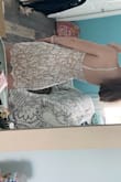 I'm in between sizes so I ordered a small and a XS and the XS hugged my body perfectly! If I had bigger boobs or butt I would go with the small. The straps are adjustable which I LOVEEE. Can't wait to wear this for my graduation! - Maddie F.