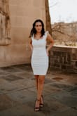 I bought this dress for my graduation pictures and it is so incredibly comfortable and flattering. I don't have a very distinguishable figure as I lack on the hip area but the fit of this dress gave me some curves which showed up so well on camera! The material is thick with a little bit of give and most importantly NOT SEE THROUGH. I am so happy with this dress. It was a more modest length on me at 5'2 so if you are someone that falls from 5'2-5'6 the length will be great. The shoulder straps part were very comfortable and the neck line was so beautifully classy. I will be wearing this to my graduation! - Cameron C.