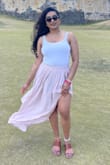 I wore this skirt on my trip to Puerto Rico! I had to wear it to travel because once I landed I didn't have time to change before touring the city! And let me tell you, super comfortable to travel with. The slit was perfect, wish it was higher but it worked lol. The material didn't bother me at all in the heat! Loved the length for my height. When I took photos by the fort close to the beach, the breeze blew it so nicely for a great photo! Fits true to size, I got a L. Highly recommend for spring or a cool summer night! You can dress this skirt up or keep it casual! - Rochelle S.
