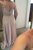I am absolutely in love with this dress! The only reason I selected that the dress runs slightly large is because it is really long, I have at least 4-5 inches on the floor. Definitely going to get the dress hemmed when I decide on what shoes to wear. The top of the dress (bust and waist) fit me perfectly! I am so pleased. There's plenty of room in the hip area as well. I need a little help in the bust department, so I am planning to wear an adhesive bra for sure. All in all, the back detail is GORGEOUS and I am so excited to wear this dress as a bridesmaid! - Hope Z.