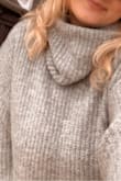 This sweater is amazing! It definitely runs big but just as you'd expect! It's long and so warm and soft! If you're looking for a less chunky look I would size down! - Eve R.