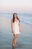 I chose this as my 2nd dress for my engagement photos session. I loved picking a white dress that was a little less formal than my first dress, but I absolutely fell in love with the plunging neck!! I was sold on this!! the back is also very unique. I wore a slip underneath since it was just slightly see-thru without one - I didn't want to worry about it showing up in the photos and you can't even tell I'm wearing one. It does have a lining but I needed an extra layer just to be safe. - Cicely A.