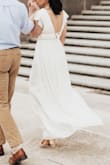 I had to get it hemmed since I'm on the short side, but once I did it looked amazing! Probably best to have some type of tape to hold the shoulders down, otherwise you may accidentally flash a boob pastie to your photographer while moving around for pictures. - Brett B.