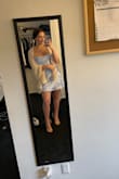 I ordered this to wear as a wedding guest in Las Vegas in May. I got it because I wanted something light that wouldn't kill me in that desert weather, and I had been wanting a satin dress for a while. I am usually a S if the dress has some sort of stretch, but the description said that this dress didn't so I ordered a M and L just incase. The medium ended up being too loose on my sides, but I was scared to order a small because the dress as it is is a little short, but nothing bad. I came back to the site to order a small anyway but they had taken it out of stock, which was weird! Anyways, the dress fits a little big, if you're between two sizes order the smaller one. I am having to take mine to a tailor to get it taken in about an inch on each side. Also the cowl neck is kinda weird, I have small boobs so I'm not the BIGGEST fan but it's alright, I might put a stitch on the inside of it to make it look runched in the front. The color is beautiful,  I paired it with nude shoes, beige scarf, and brown clutch. - Amanda M.