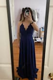 I always look at reviews before I get a dress so I wanted to write one in case your in the same position as me! The model photo makes the dress look kinda greyish blue but the dress in person is a dark blue. It's really pretty and fit me perfectly! It's super flowy and covers your bust area nicely. It also has adjustable straps which really helped. The only thing is that it's really long, I'm 5'3" and even wearing heels only helps a little. overall, I really recommend this dress! - Mary L.