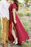 I bought this for my engagement photos and am in LOVE with this! I can't wait to find another occasion to wear it. I went off other reviews and picked a medium and it fit perfectly. This dress is thick enough to cover any flaws but not too thick where you couldn't wear it during warmer weather. The slit in the dress is beyond perfection. It gives your legs the perfect shape when they come through. I did wear heels and still stepped on the dress a little but for just a photoshoot this was not a big deal. If you were wearing this out and you're not tall, just plan on needing it hemmed. Nothing crazy though and does not take away from the beauty of this dress. I wore a sticky bra but you could get away with a normal bra if it doesn't go too low on your back. 100% recommend! - Erika S.