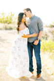 I absolutely love this dress. I wore it for my engagement photos. It was quite long on me since I am 5'3 so I had to get it hemmed. Also, I had to order a size XL because the chest area was too tight. - Jennifer D.