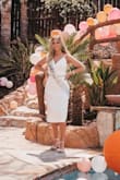 This dress was more than I thought it would be. I wore it for my bridal shower and the way it fits is so comfy and I got soooo many compliments on this dress. The back is laced and it is beautiful!! I dressed up the waist with a sparkly belt. - Heather G.