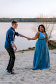 This dress is absolutely a gorgeous color and fabric. I wore it for the formal shots of our engagement shoot. The only issue is since it is quite open over the cleavage and the side of the chest, if you have a larger chest you will struggle with cleavage and a LOT of side boob. In the end I wasn't as confident in the dress as I could have been had the dress covered a little more and I had to have the photographer edit out my boob tape. But if you have a smaller chest I think this dress is perfect for you. It's still very beautiful. - Marlaya R.